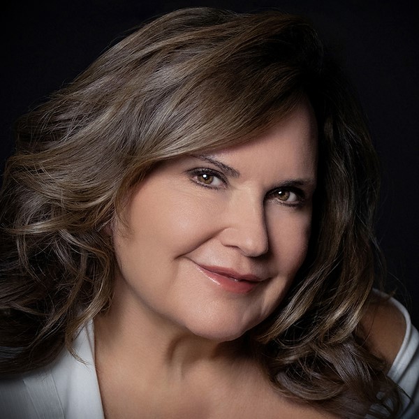 Women with brown hair and white shirt.