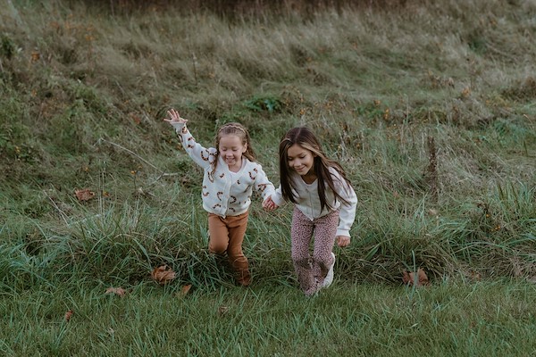 Candid family moment filled with laughter during fall session in Dowagiac MI