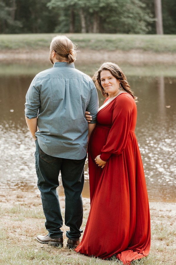 Mom and dad standing by the pond at Rustic Ridge, Deridder Louisiana