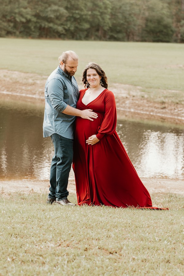 mom and dad in front of the pond at Rustic Ridge, Deridder Louisiana